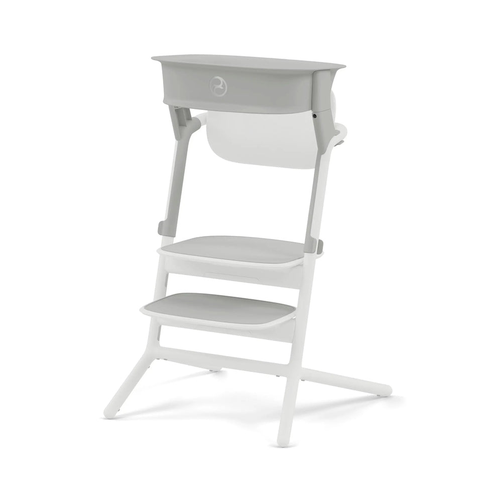 Studio product image of the Cybex Lemo Training Tower in white and gray stands open with three stepped platforms for toddler training.