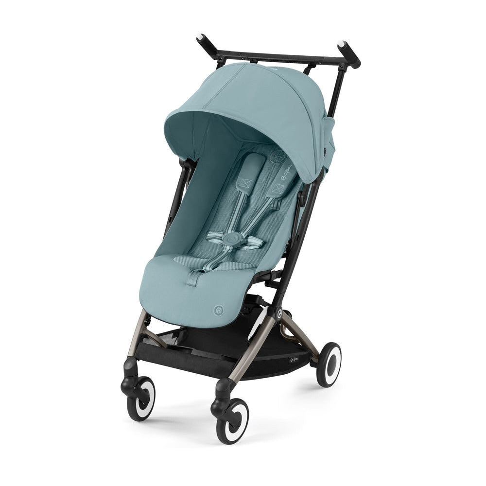 Close-up of the Cybex Libelle 2 Stroller in teal with extended canopy and visible 5-point harness, ready to stroll on four wheels.