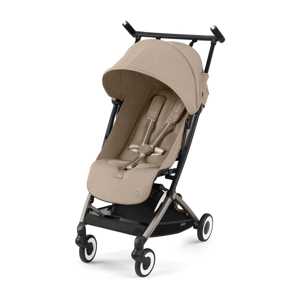 Close-up of the Cybex Libelle 2 Stroller in beige fabric with black frame; canopy extended as it glides forward on smooth wheels.