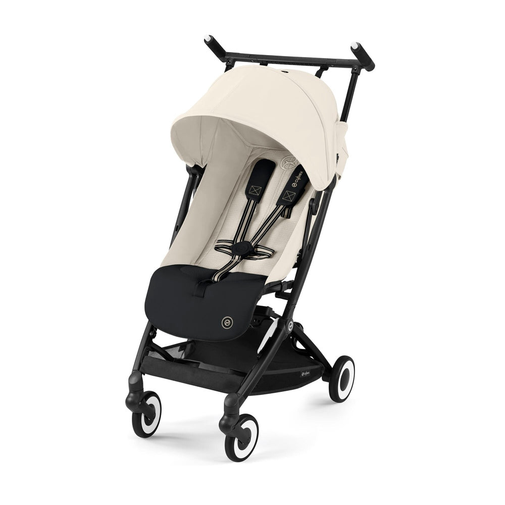 Close-up of the Cybex Libelle 2 Stroller in beige fabric with black frame, ready to push on a 4-wheel base.