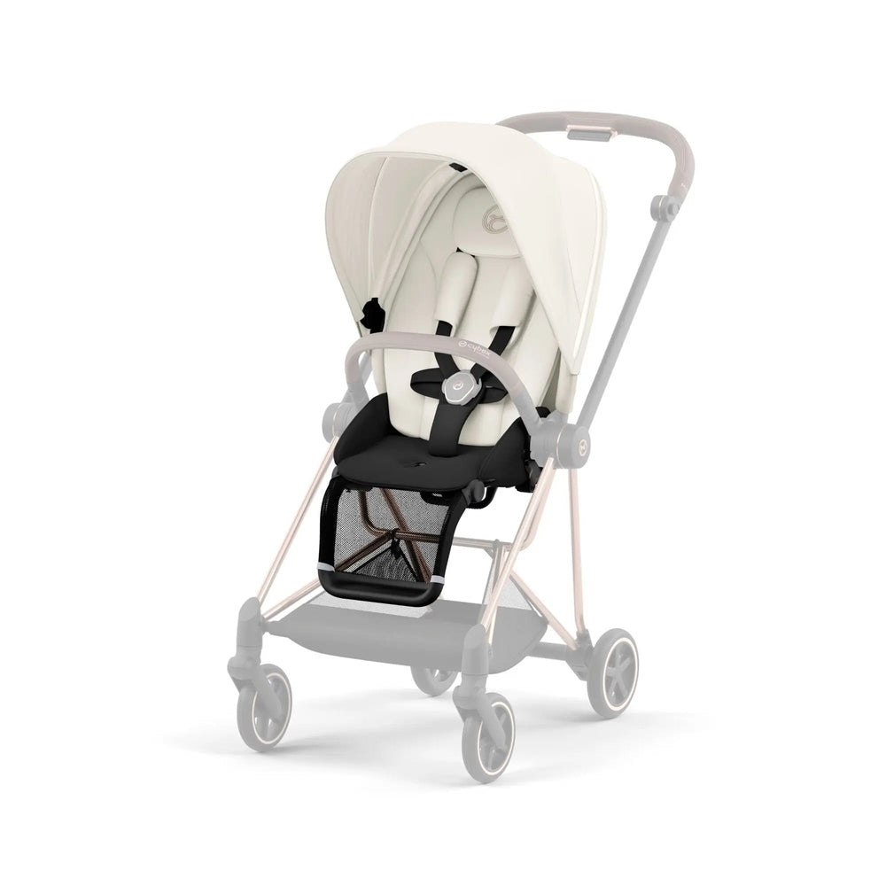 Lifestyle image of the Cybex Mios3 Seat Pack stroller in cream with gray frame and black seat pad; canopy extended.