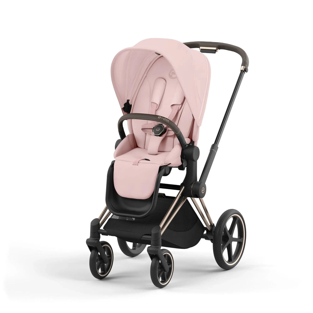 Studio product image of the Cybex Platinum Priam 4 Luxury Stroller in blush pink with rose gold frame, front three-quarter view on white background.