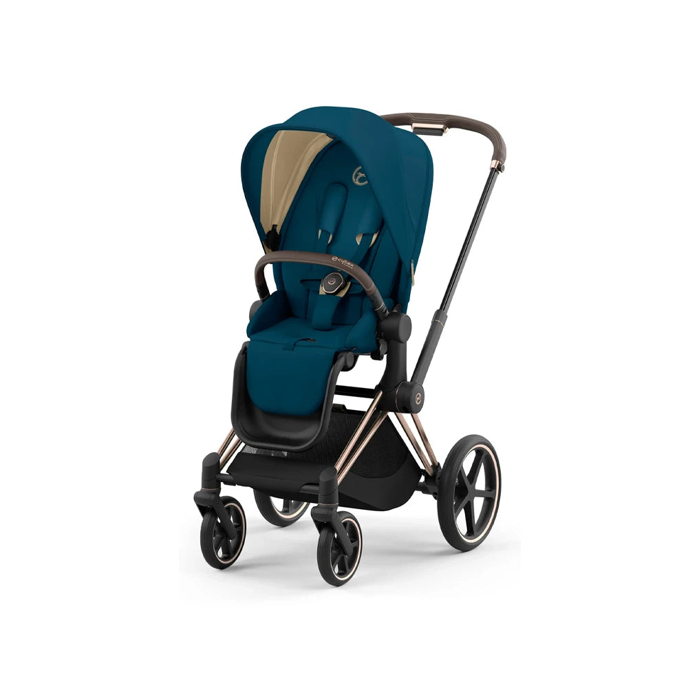 Studio product image of the Cybex Platinum Priam 4 Luxury Stroller in teal blue with bronze frame, front three-quarter view on white background.