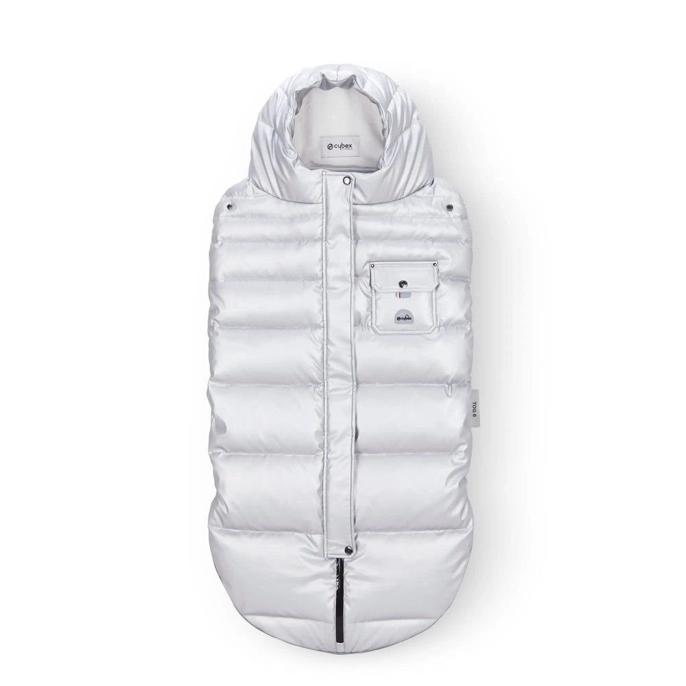 Close-up of the Cybex Winter Footmuff in silver quilted fabric with front pocket; insulated zip closure keeps baby warm on winter stroll.