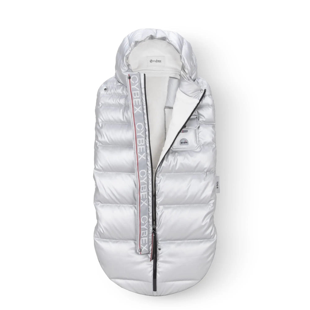 Close-up of the Cybex Winter Footmuff in silver quilted finish with hood and front logo patch, ideal for winter stroller strolls.