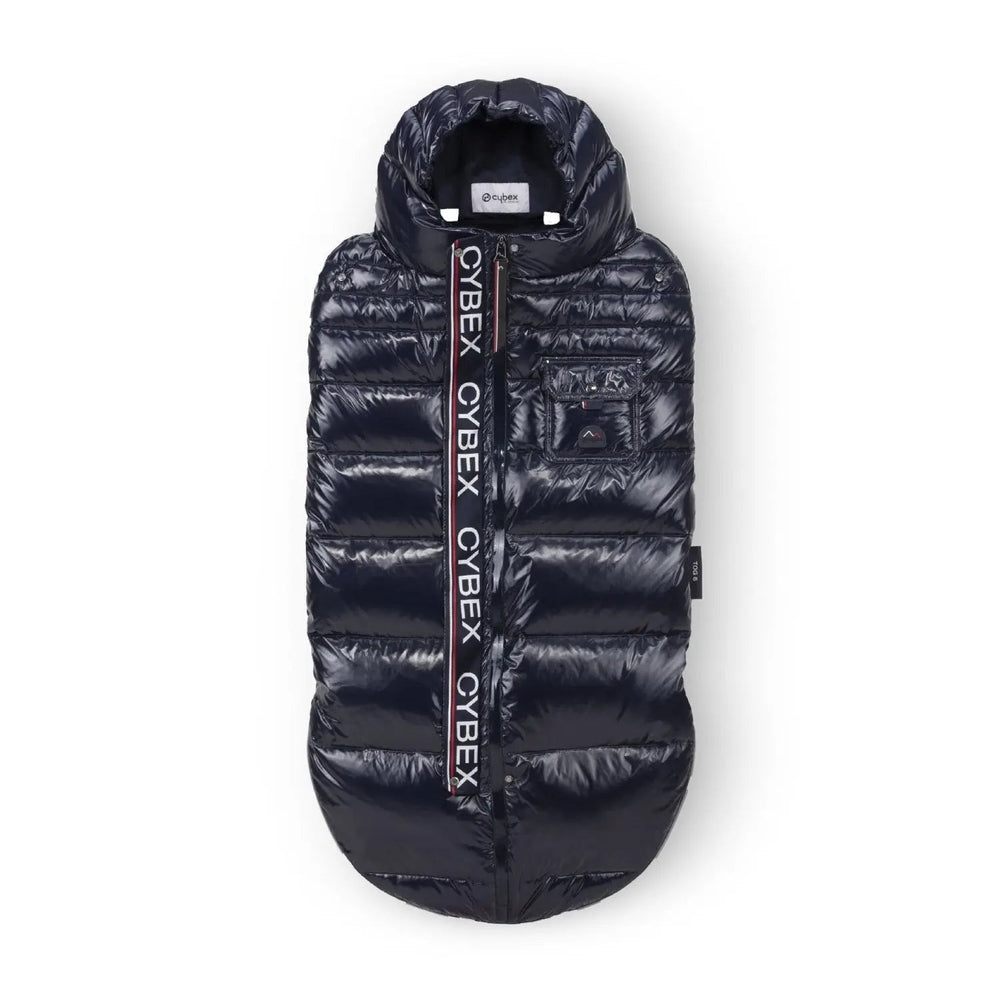 Close-up of the Cybex Winter Footmuff in navy quilted puffer with front zip and cybex logo strap, ready for stroller use.