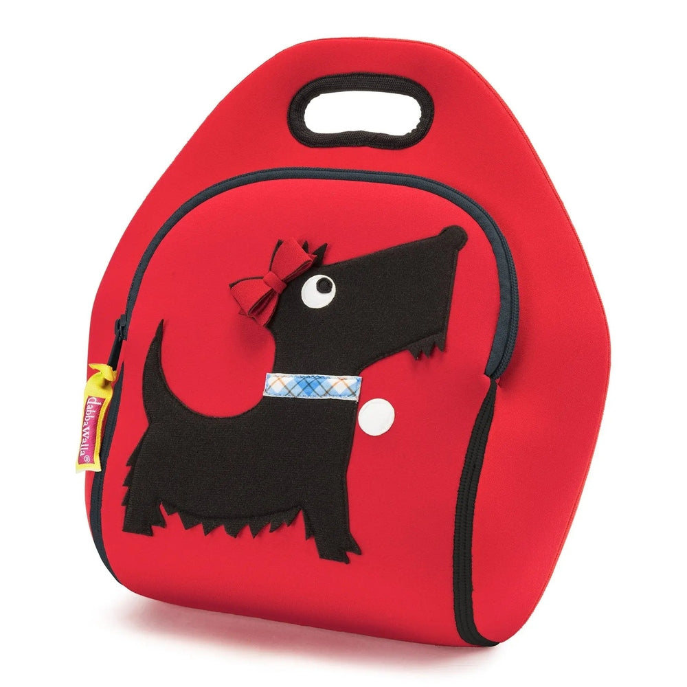 Dabbawalla Lunch Bag red with black dog applique, bow, blue plaid collar, shown with top handle for easy carrying.