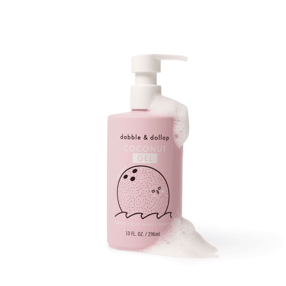 Dabble & Dollop All-Natural Shampoo, Body Wash & Bubbles Coconut pink bottle with pump dispensing foamy bubbles.