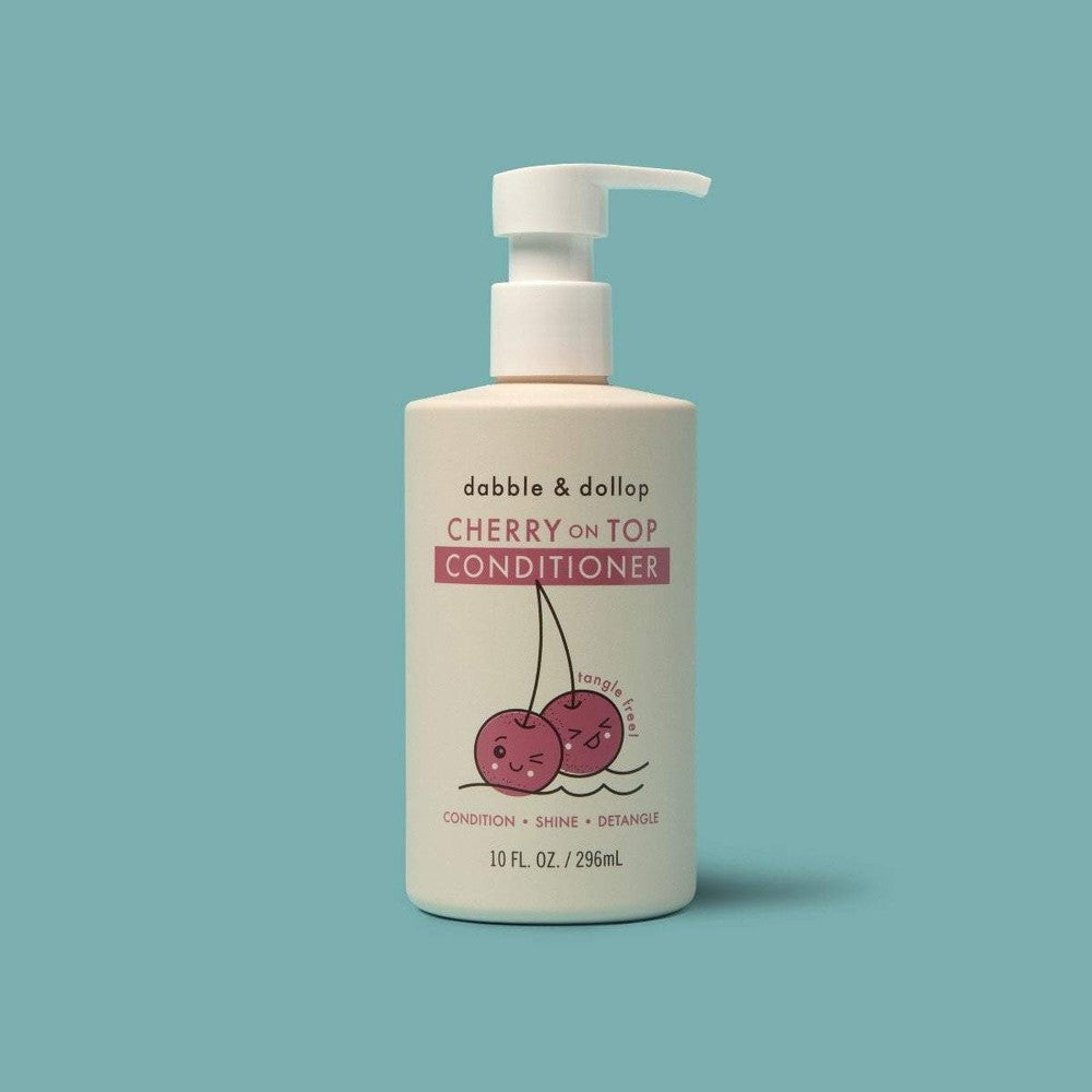 Dabble & Dollop Cherry on Top conditioner bottle with pump, white label and cherry graphic.
