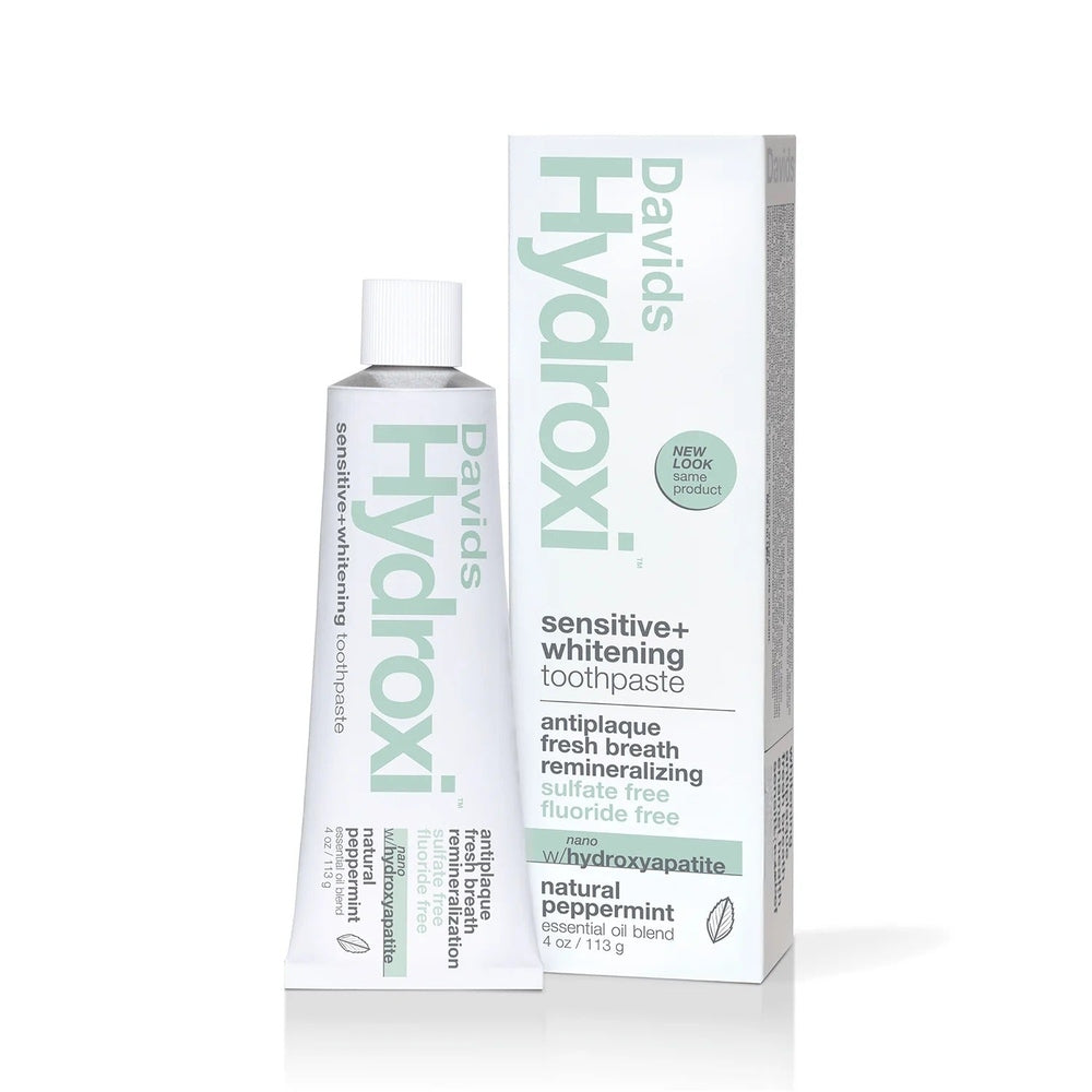 Davids toothpaste Sensitive+ Whitening fluoride-free peppermint tube beside its minty box, brand-forward packaging.