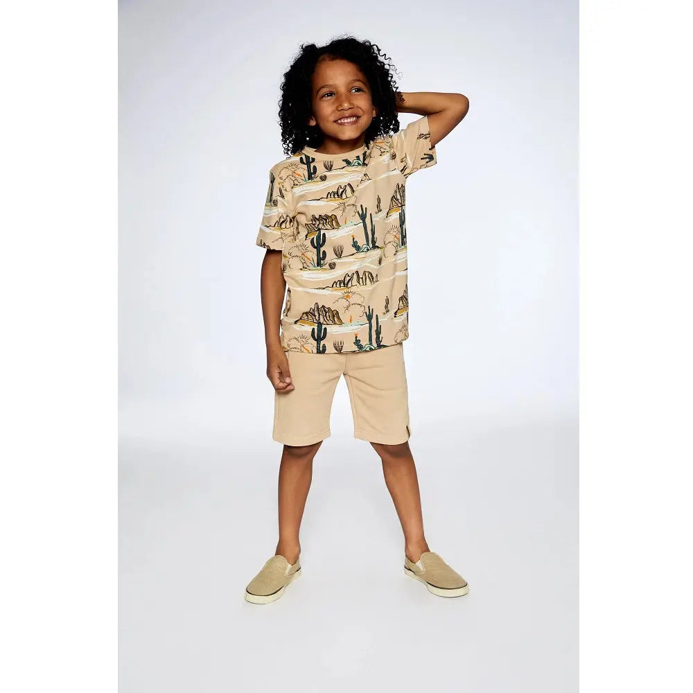 Deuxpardeux French Terry Short With Zipper Pockets Beige, kid wearing beige shorts showing side zipper pockets.