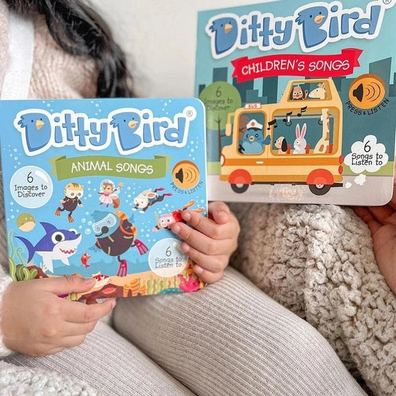 Ditty Bird Sound Book Animal Songs, blue cover, held by kids on a couch showing colorful animal illustrations
