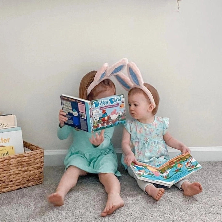 Ditty Bird Sound Book Classical Ballet Music USB-C Rechargeable, two toddlers in bunny ears read the colorful book together.