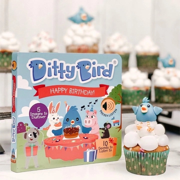 Ditty Bird Sound Book Happy Birthday USB-C Rechargeable toy; blue bird on a cupcake beside the gift-box illustration.