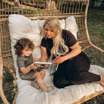 Ditty Bird Sound Book Music to dance to USB-C Rechargeable-mother and child read it together on a sunny outdoor swing.
