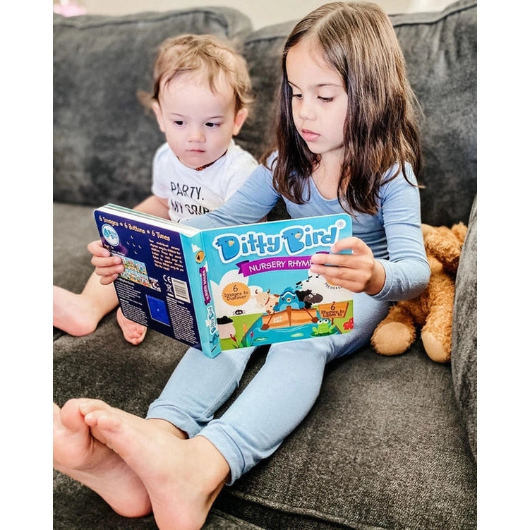 Ditty Bird Sound Book Nursery Rhymes USB-C rechargeable with colorful cover read by two kids on a sofa.