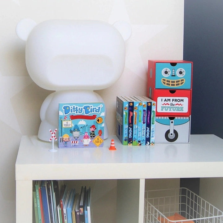Ditty Bird Sound Book When I Grow Up Career Songs USB-C Rechargeable set, shown with six colorful Ditty Bird books on a white shelf.