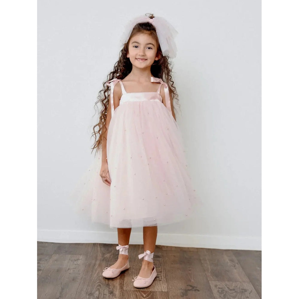 Dolly By Le Petit Pearl 2-Cute Tulle Dress Dolly Pink worn by smiling toddler in pink satin straps with matching headband