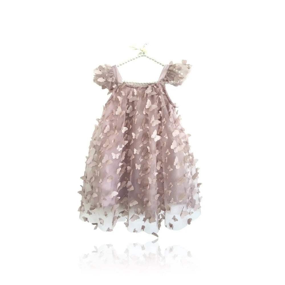 Dolly By Le Petit Tom Allover Butterflies Tutu Dress Mauve Pink on a hanger, showcasing 3D butterfly appliques and airy tulle.
