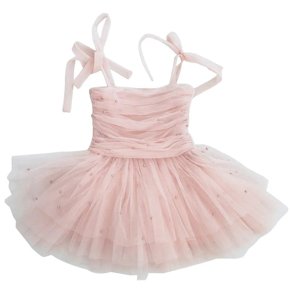 Dolly by Le Petit Tom Pearl Tulle Ballerina Dress in pink, ribbon straps tied, pearl beads on bodice.