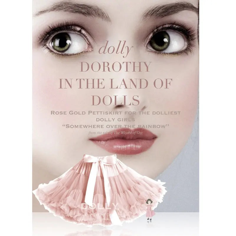 Dolly by Le Petit Tom Dorothy in the Land of Dolls Ballet Pink Pettiskirt, fluttering around a tiny doll before a large face poster.