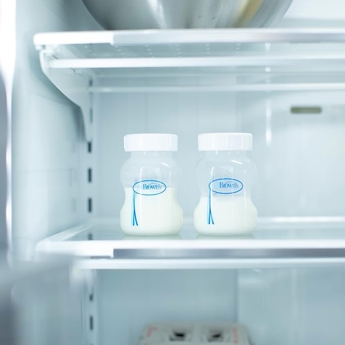Dr. Brown's Wide Neck Storage Travel Caps 2-Pack in White on fridge shelf