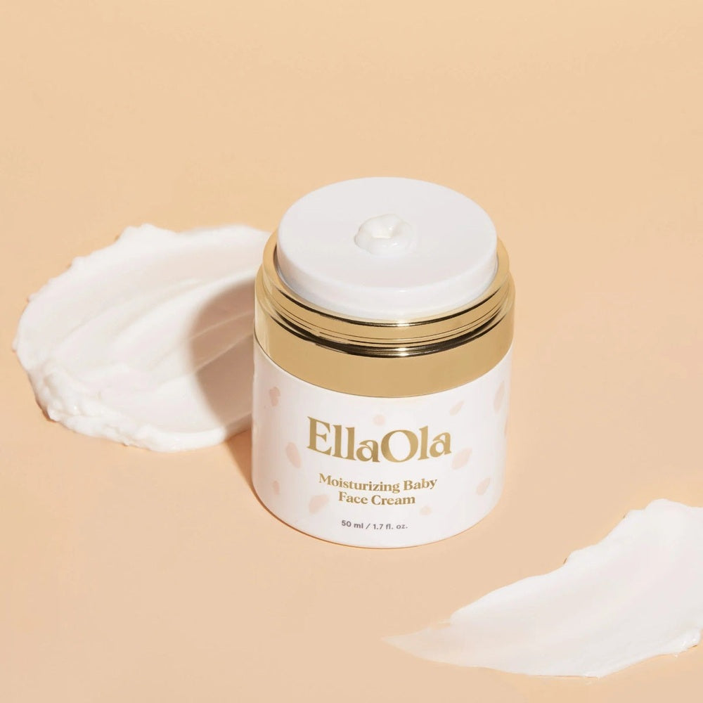 EllaOla Fragrance Free Moisturizing Baby Face Cream, 50 ml jar with gold lid, cream dab on top.
