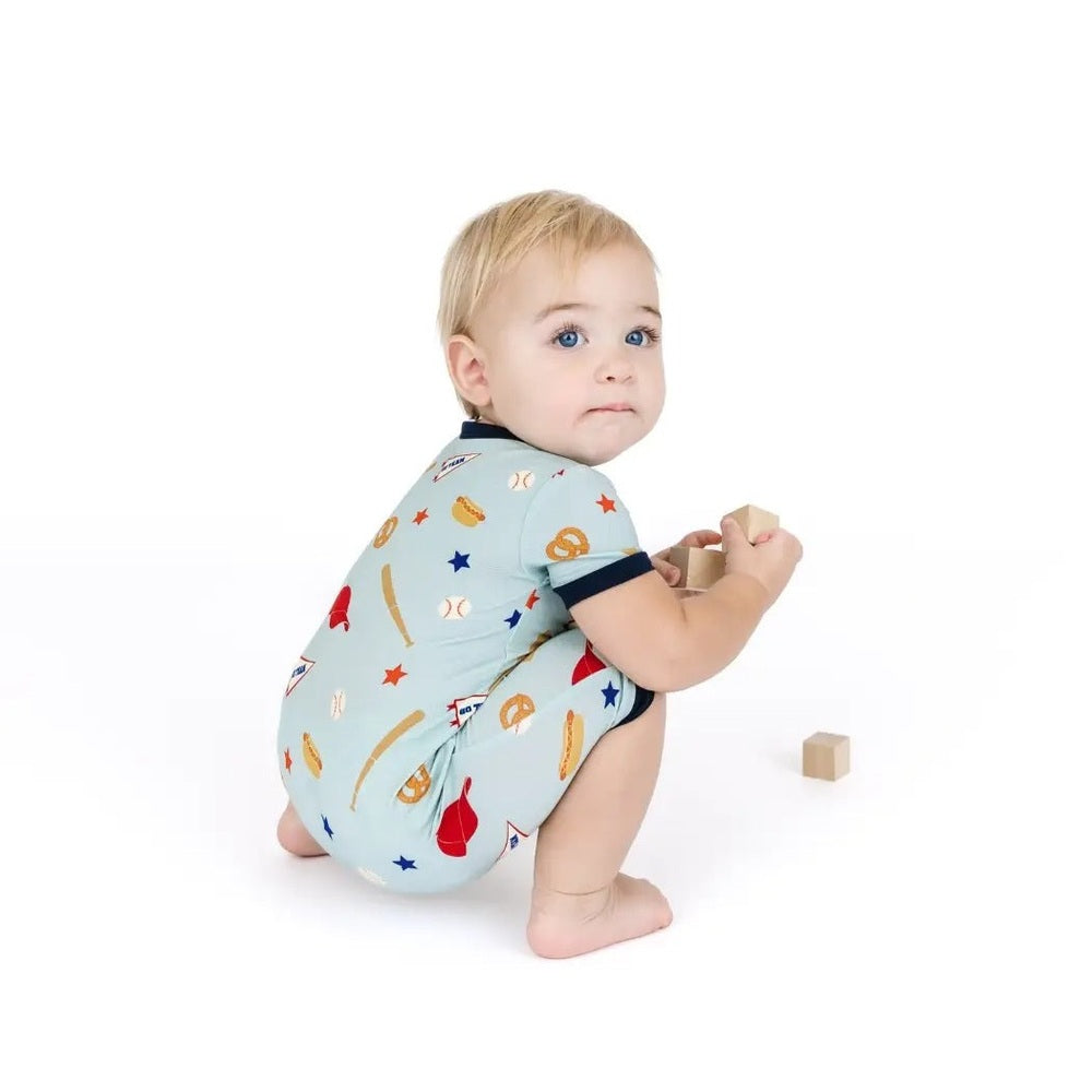 Baby romper with sports-themed pattern on a white background