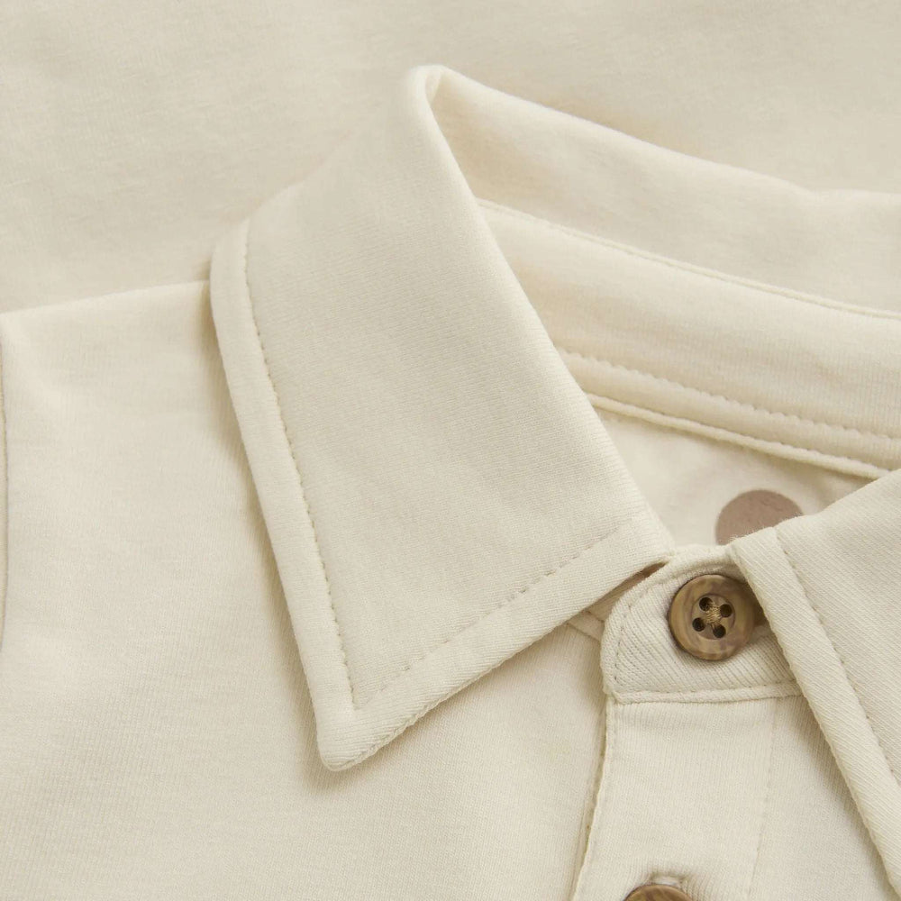 En Fant baby body long-sleeve shirt in cream mother-of-pearl with brown buttons