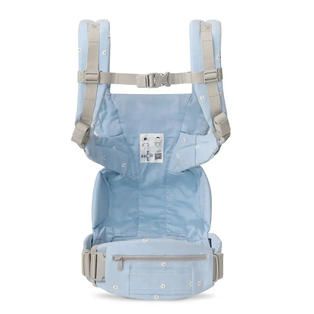 ERGOBABY Omni Deluxe Carrier Mesh in light blue with beige straps, showing buckled chest strap and front zip pocket.