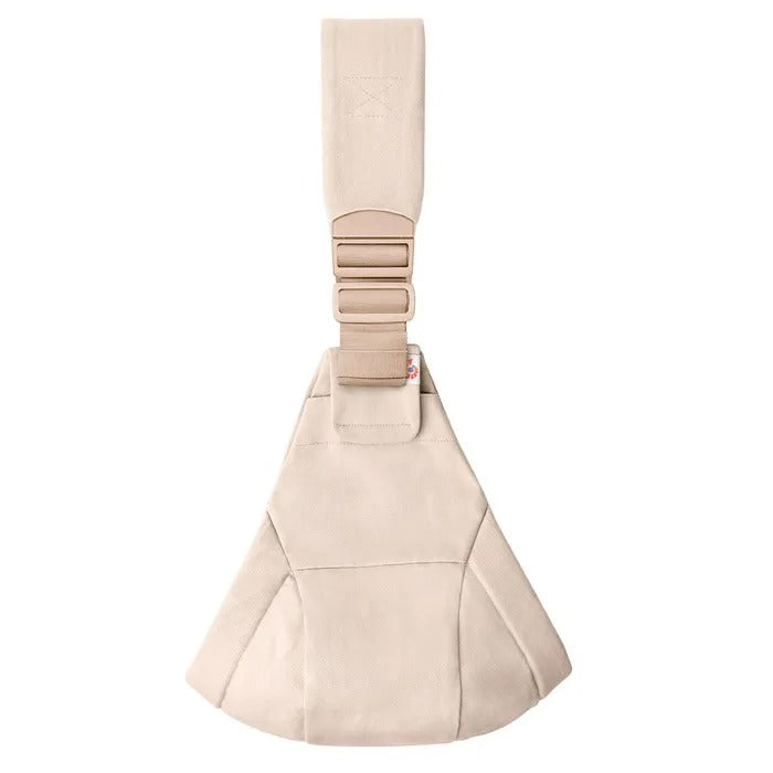 Ergobaby Upsie Sling Carrier in beige, showing adjustable padded strap and buckles for secure wear.