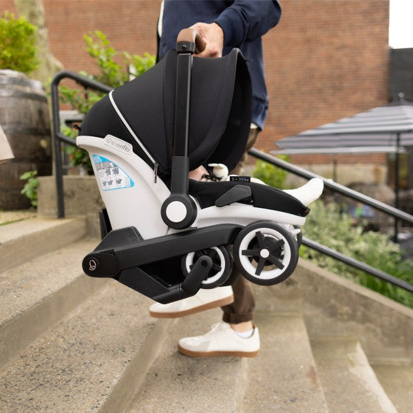 Evenflo Gold Shyft Dualride infant car seat and stroller with Carryall storage, black/gray frame