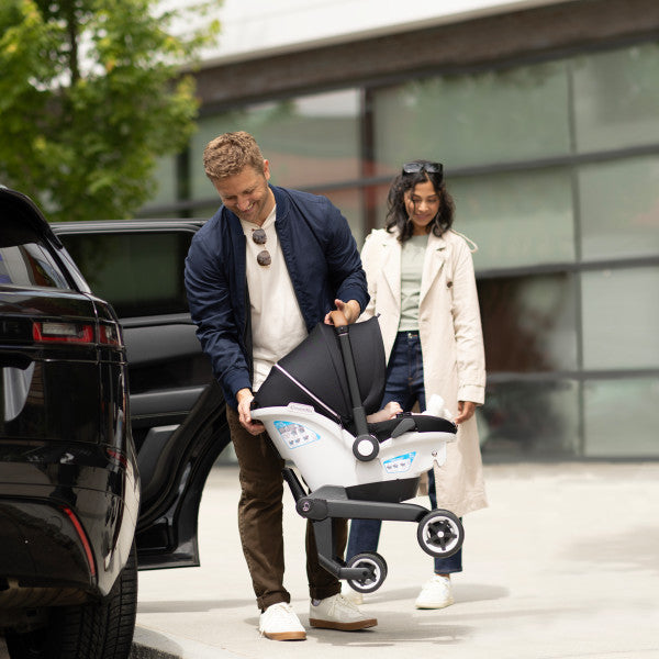 Evenflo Gold Shyft Dualride travel system with Carryall Storage, white and gray infant car seat and stroller