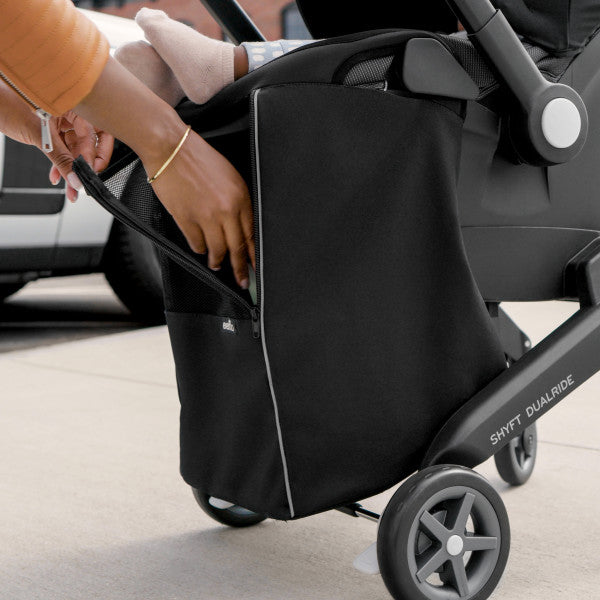 Evenflo Gold Shyft DualRide infant car seat and stroller combo with Carryall storage bag