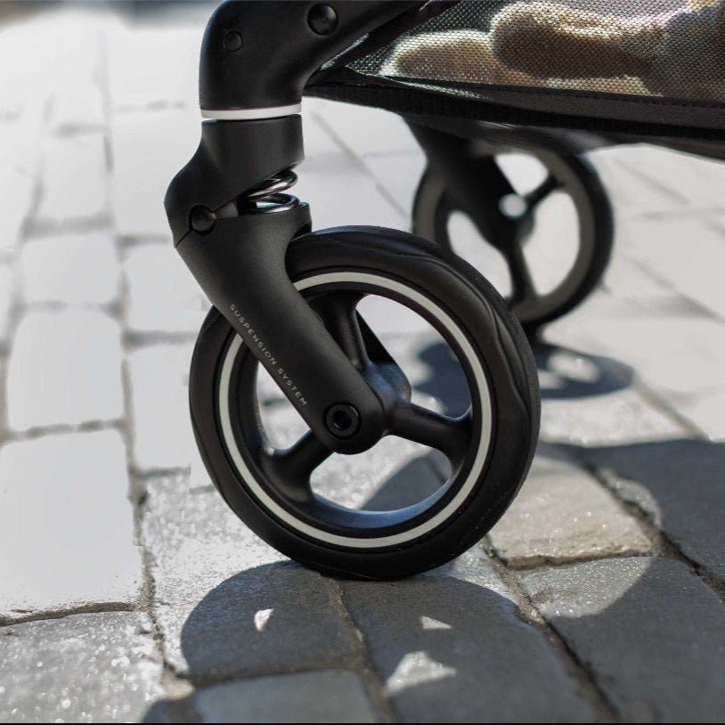 Evenflo Hummingbird ultralight carbon fiber stroller front wheel with black frame and white rim