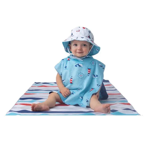 Flapjackkids Cover Up Shark/Nautical in light blue, baby wearing hooded poncho and matching hat on striped mat.