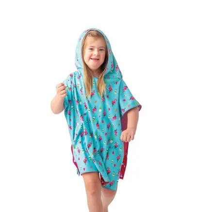 Flapjackkids Cover Up Unicorn/Tropical, turquoise hooded poncho with floral print worn by a smiling child