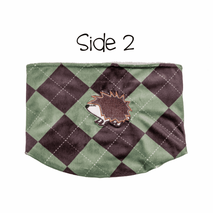 Flapjackkids kids neck warmer, reversible green and brown argyle with a hedgehog patch