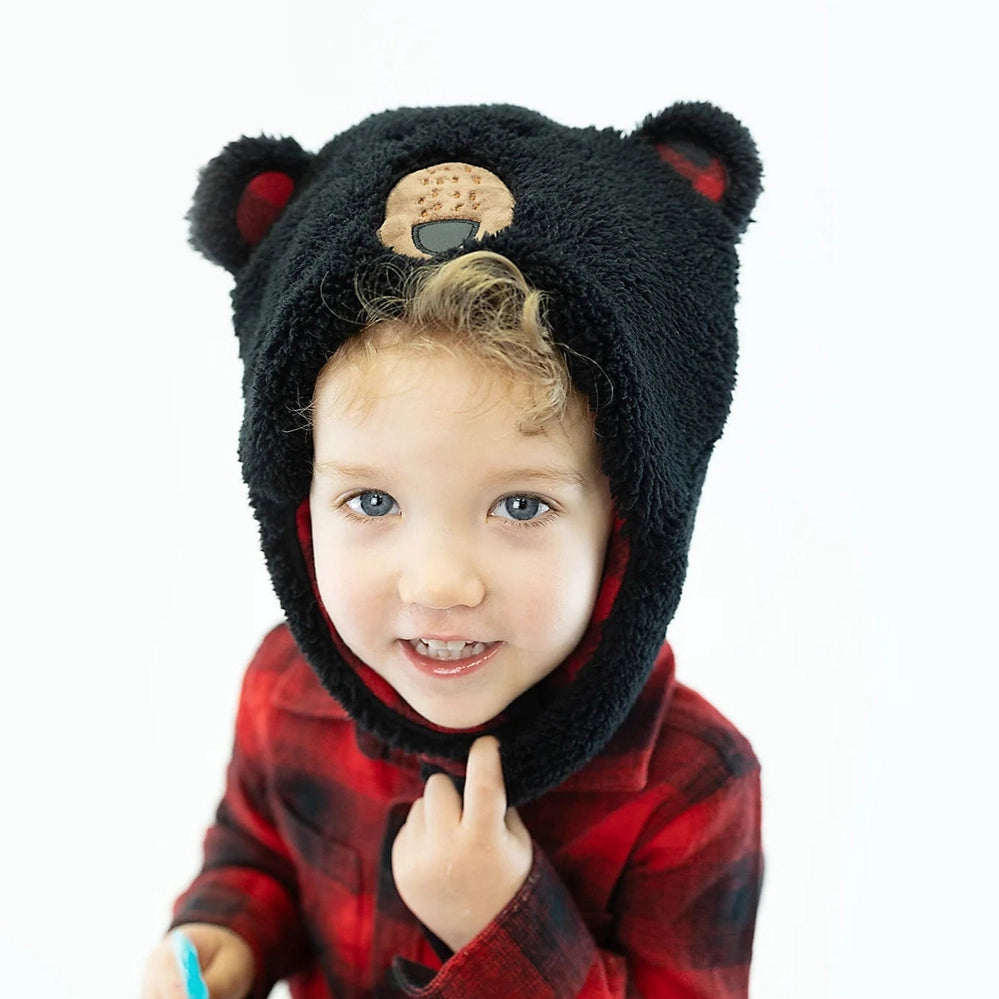 Flapjackkids reversible sherpa hat in black bear design, toddler wearing red plaid shirt