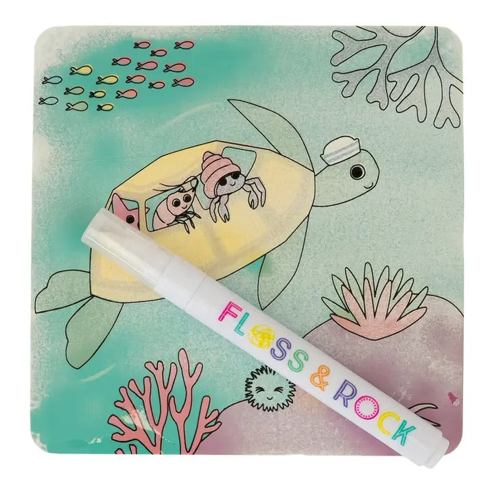 Floss And Rock Magic Color Changing Water Cards Ocean marker rests on a colorful underwater scene with a turtle and coral.