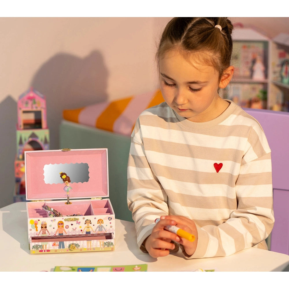 Floss And Rock Musical Jewellery Box Best Friends in pink, open with mirror as a girl sorts accessories.