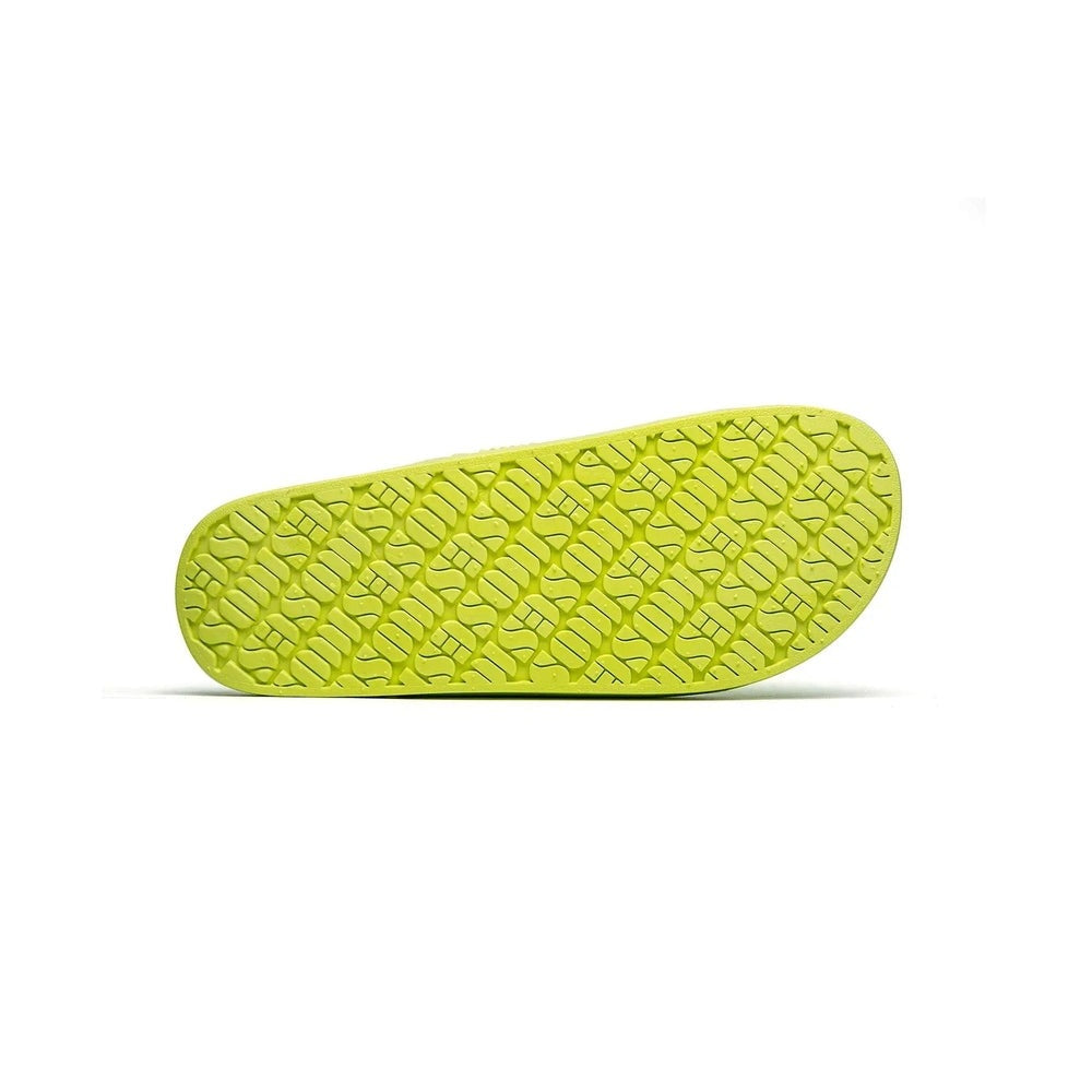 Freedom Moses Basic Alice Yellow Neon slipper sole in bright lime rubber with chunky tread showing grip.