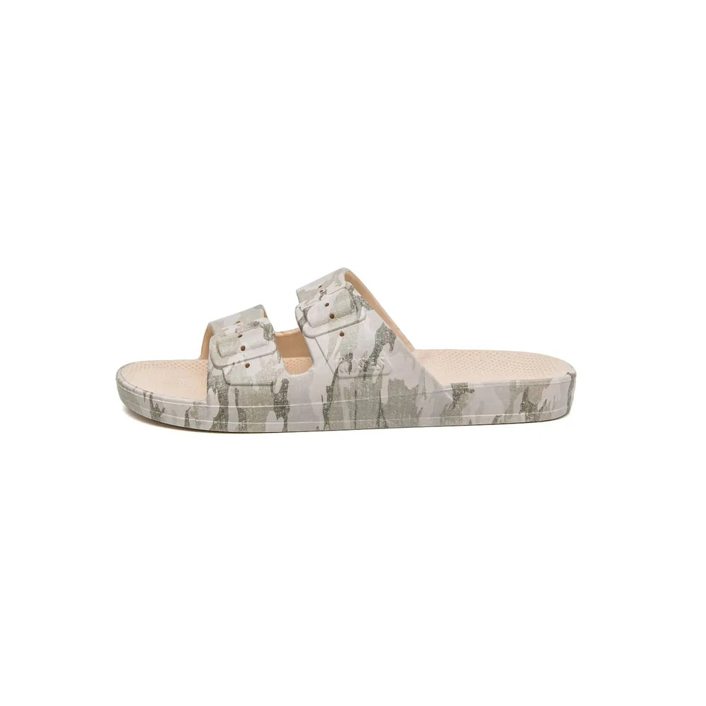 Freedom Moses Prints Adult Camo Stone slide sandal with double camo straps shown on a beige footbed.