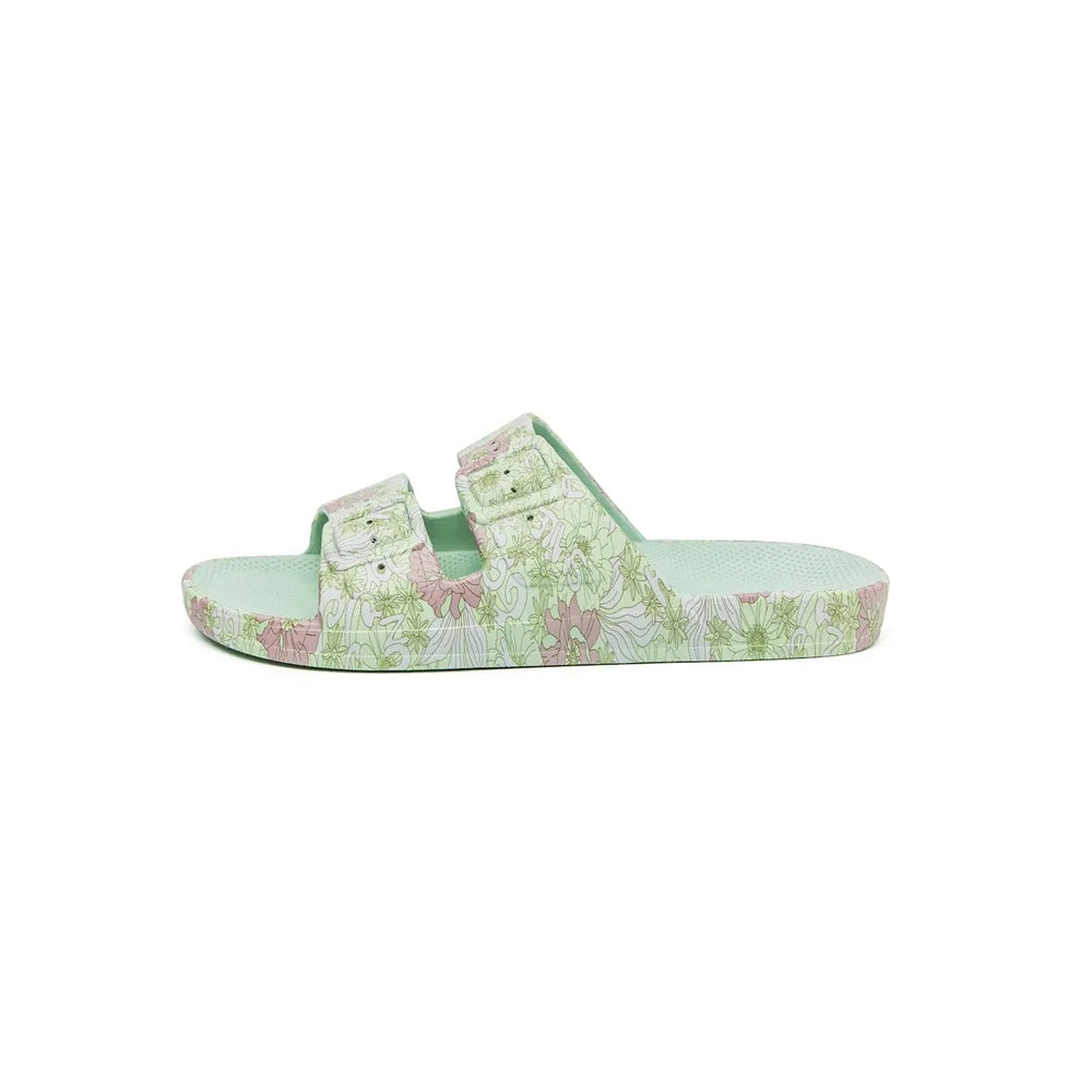 Freedom Moses Prints Adult Smile Sage slide sandal in pastel floral print, showing easy slip-on styling.