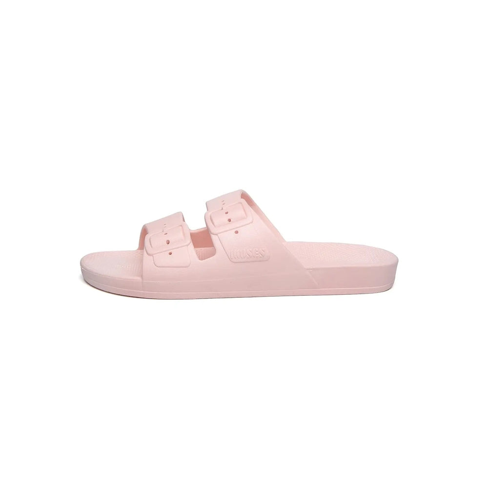 Freedom Moses Prints Pina Rosa pink rubber slide sandal with dual buckle straps, shown as a casual slip-on.