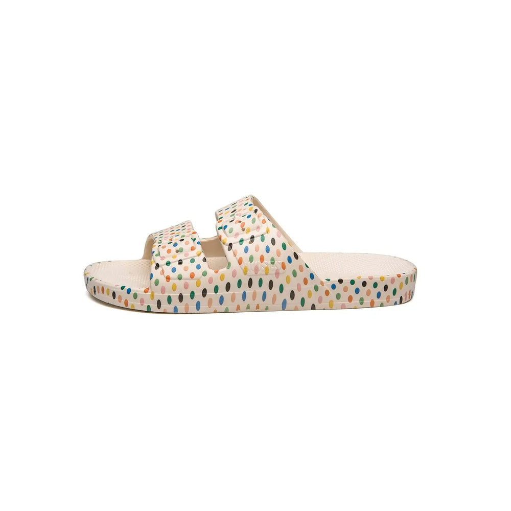 Freedom Moses Prints Retro Dots white sandals with two straps, multicolor polka dots, displayed on a clean surface.