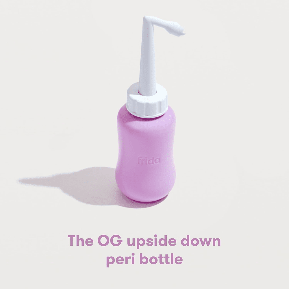 Frida Mom upside-down peri bottle; pink plastic with white pump for personal care