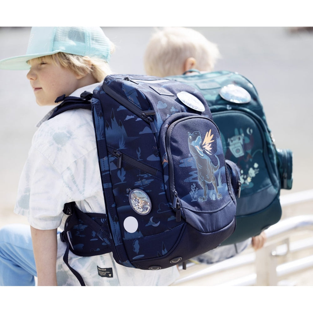 Frii of Norway 22L school backpack with navy dinosaur print and side pockets