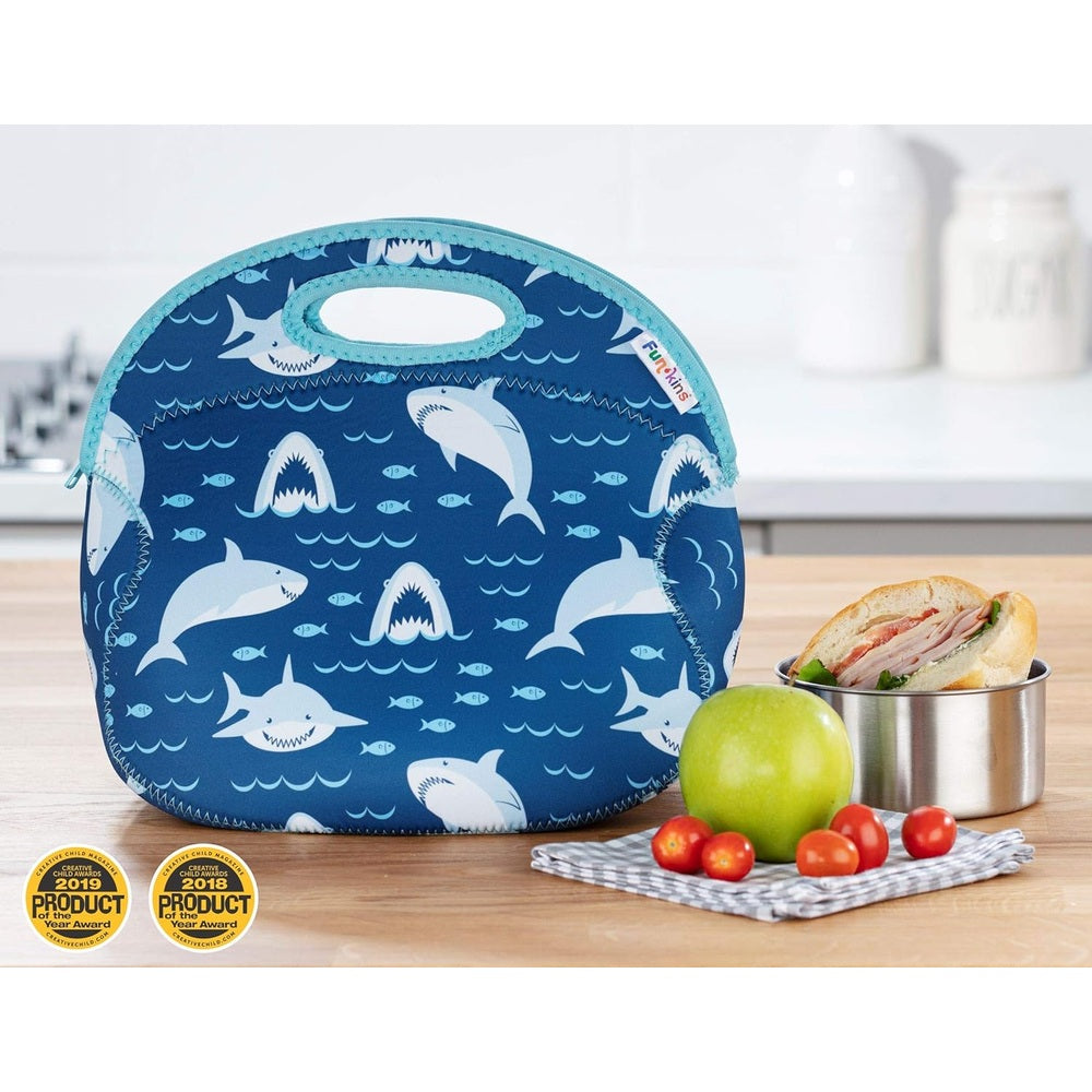 Blue insulated lunch bag with white shark print, teal trim and built-in handle