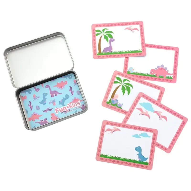 Funkins Lunchbox Note Cards in pink-bordered dinosaur designs with palm trees beside a silver lunchbox